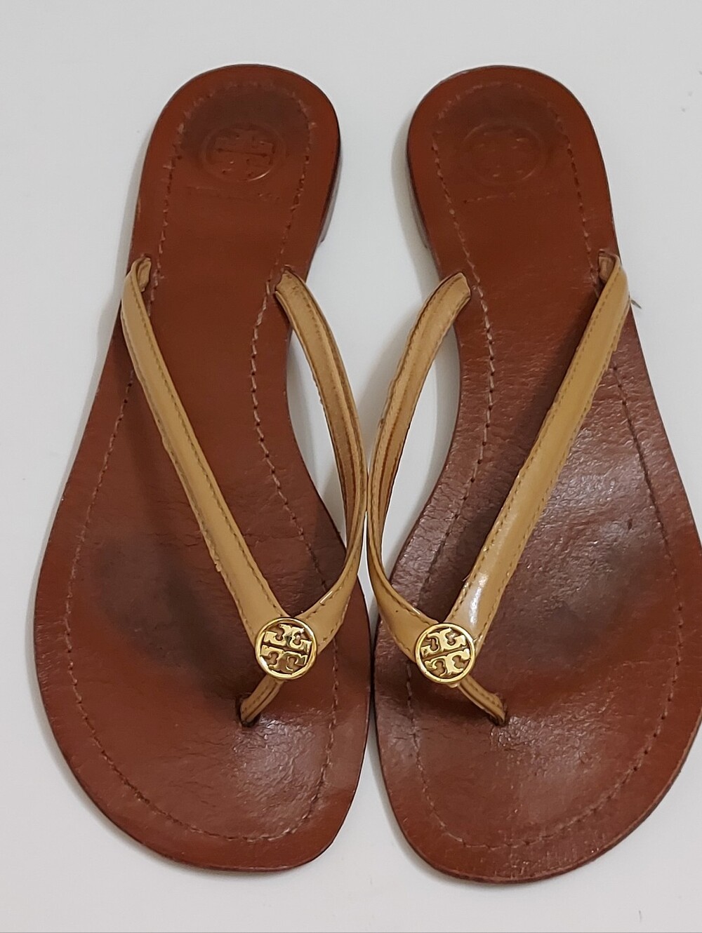 Tory Burch Brown Leather Flip Flop Sandals with Tan Straps and Gold Medallion